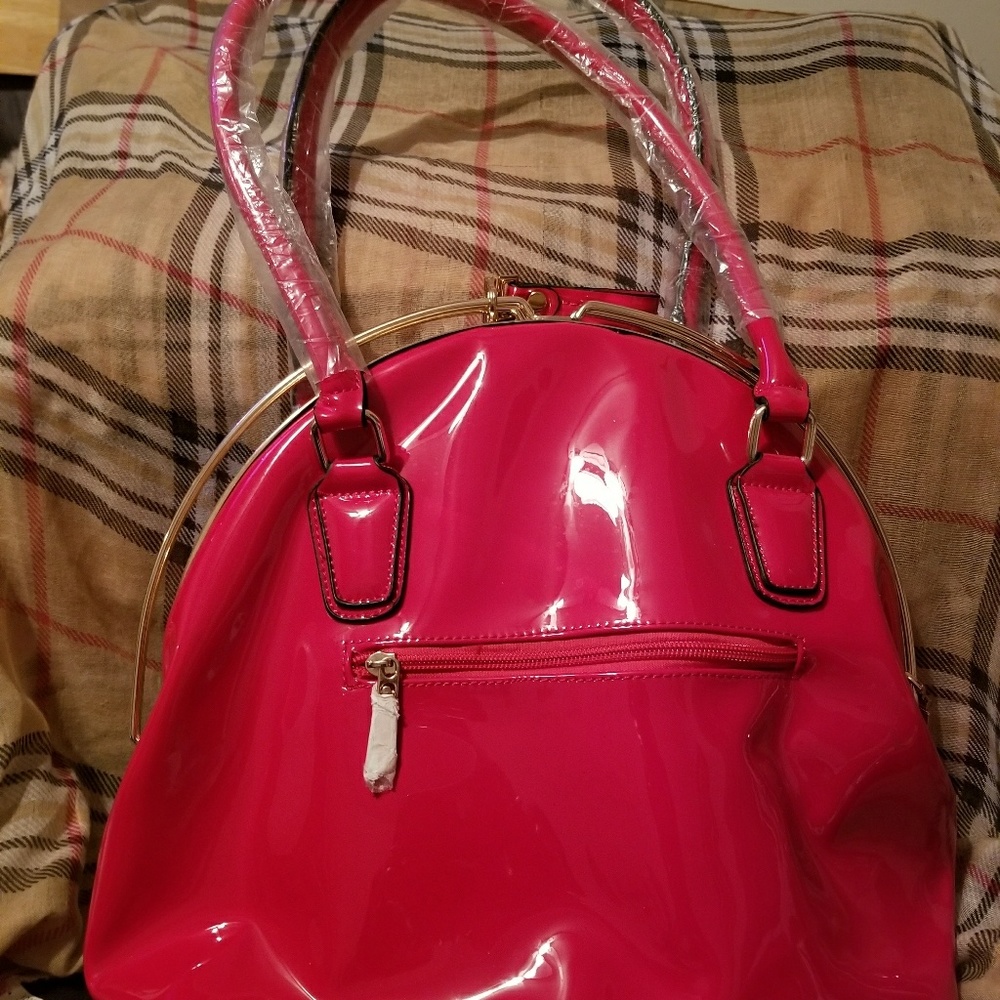 A Redhandbag. Never used. Has small ink stain